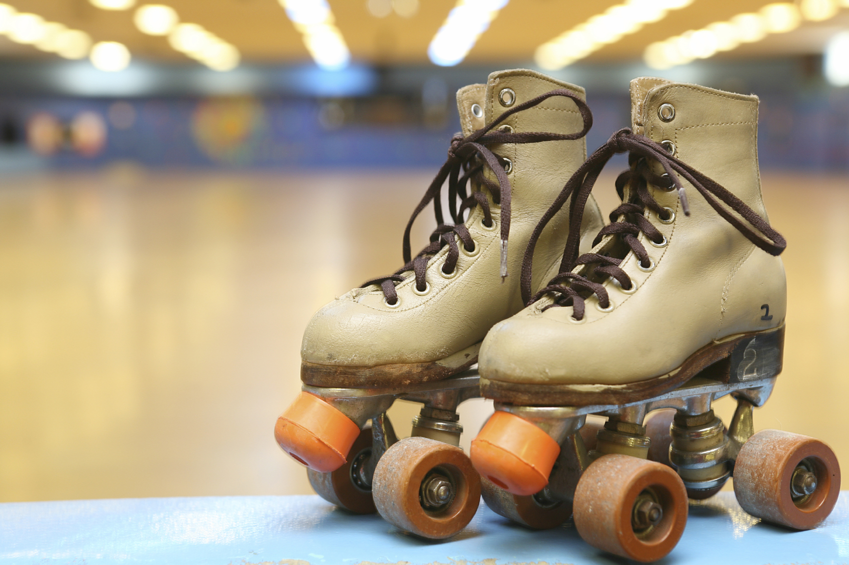 A pair of classic roller skates at a skating rink